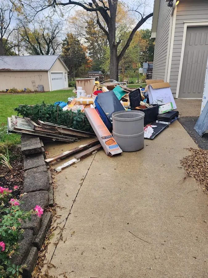 Dumpster being loaded with debris for Estate Cleanout Dumpster Rental in Bordentown